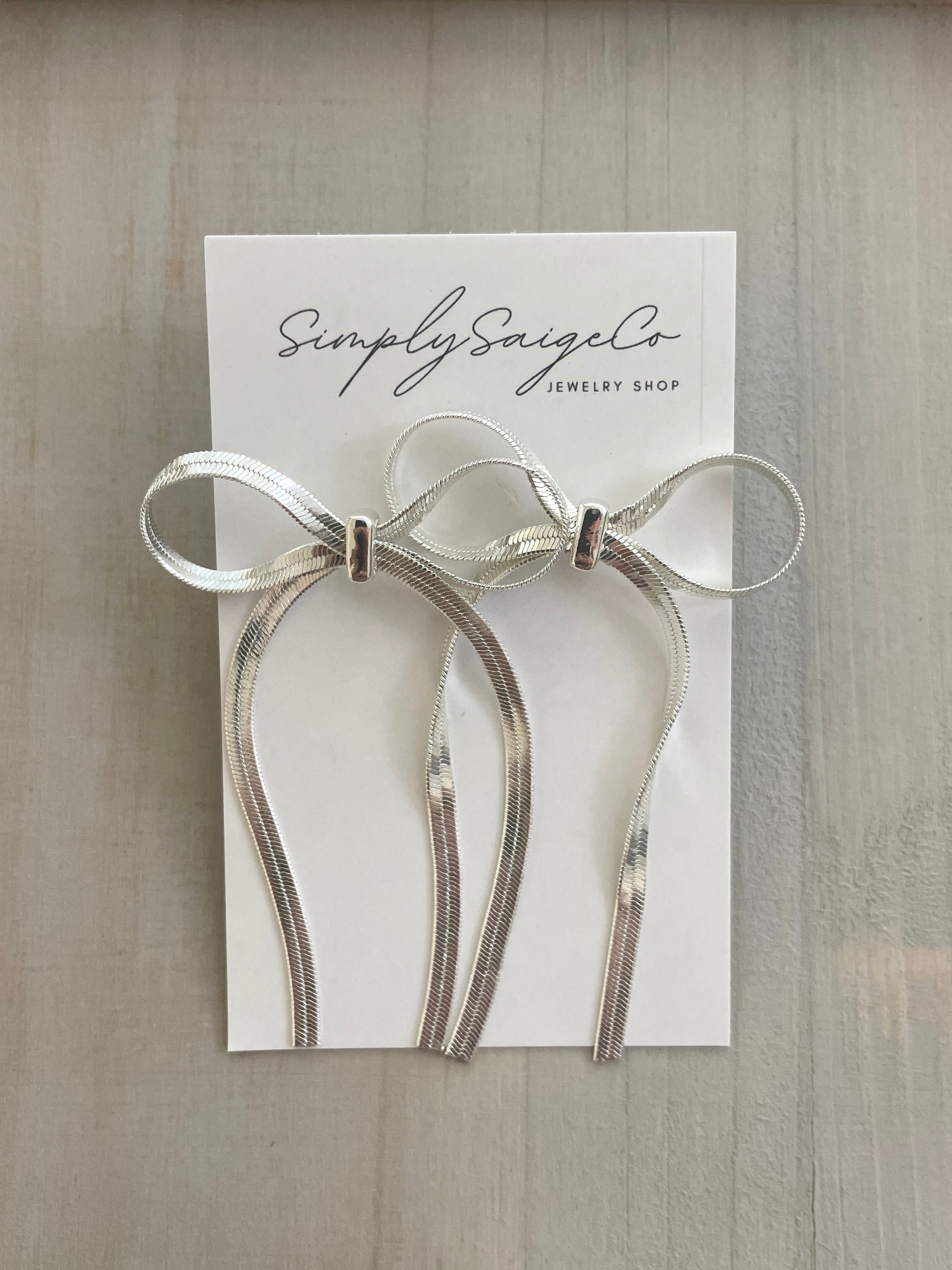 Silver Bow Dangle Earrings 